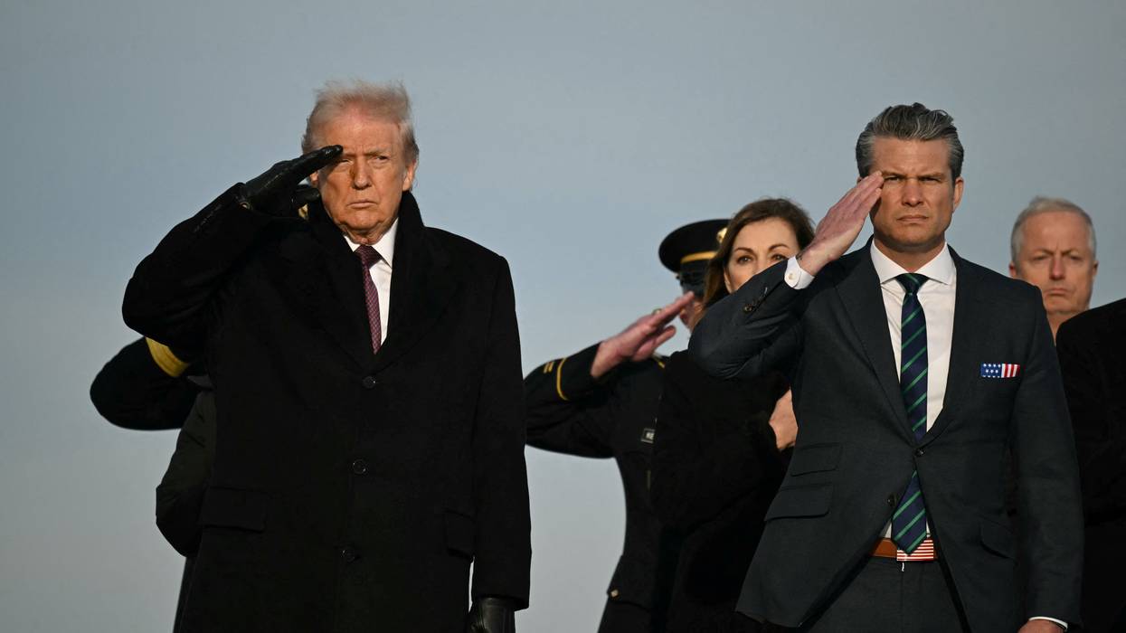 Donald Trump and Pete Hegseth salute