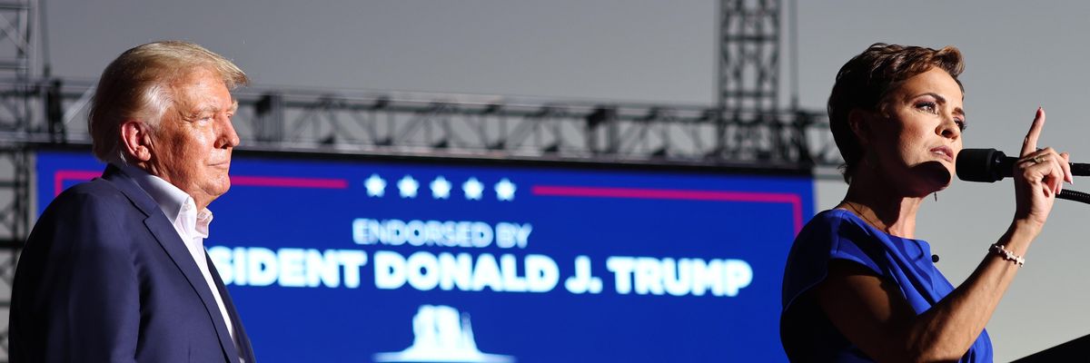Donald Trump and Republican Kari Lake on stage at a rally for Lake in Arizona