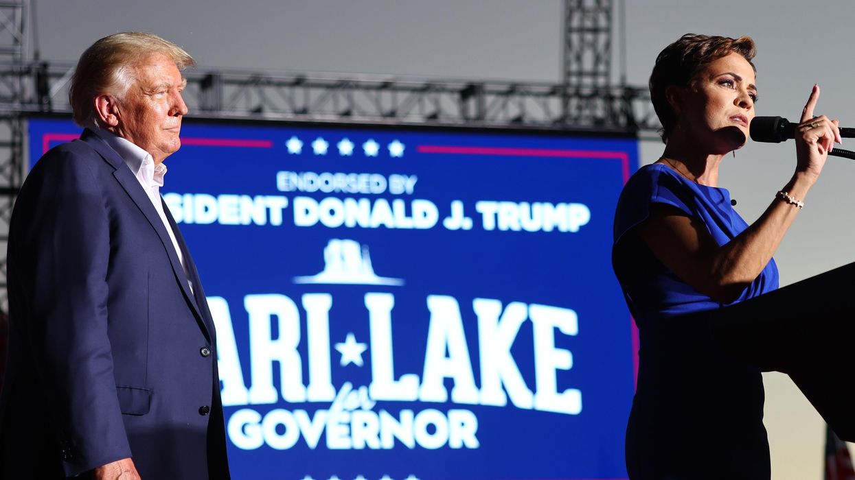 Donald Trump and Republican Kari Lake on stage at a rally for Lake in Arizona