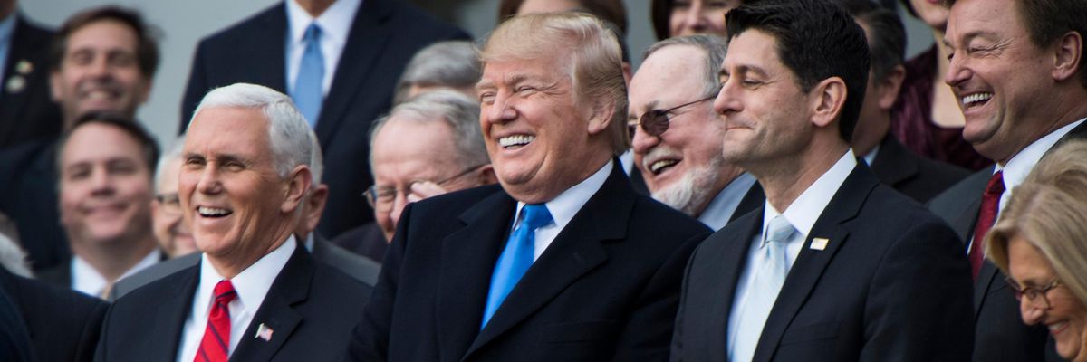 Donald Trump and Republican lawmakers celebrate passage of their tax-cut bill