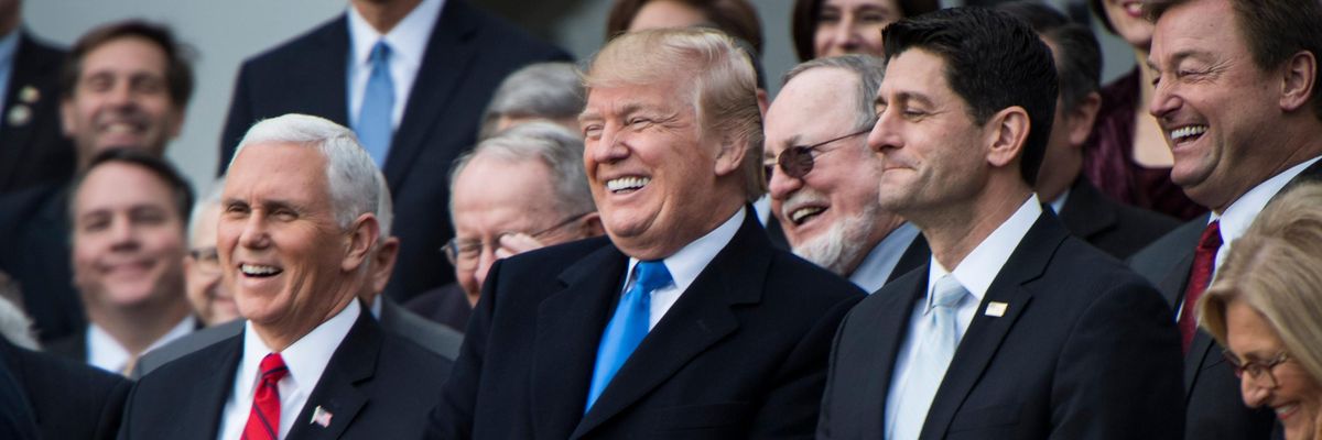 Donald Trump and Republican lawmakers celebrate passage of their tax-cut bill