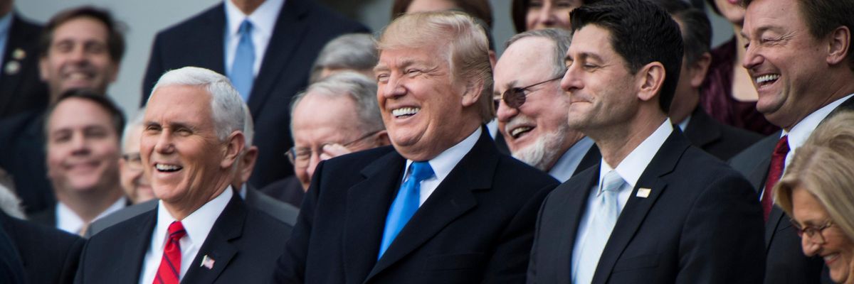 Donald Trump and Republican lawmakers celebrate passage of their tax-cut bill