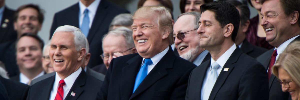 Donald Trump and Republican lawmakers celebrate passage of their tax-cut bill