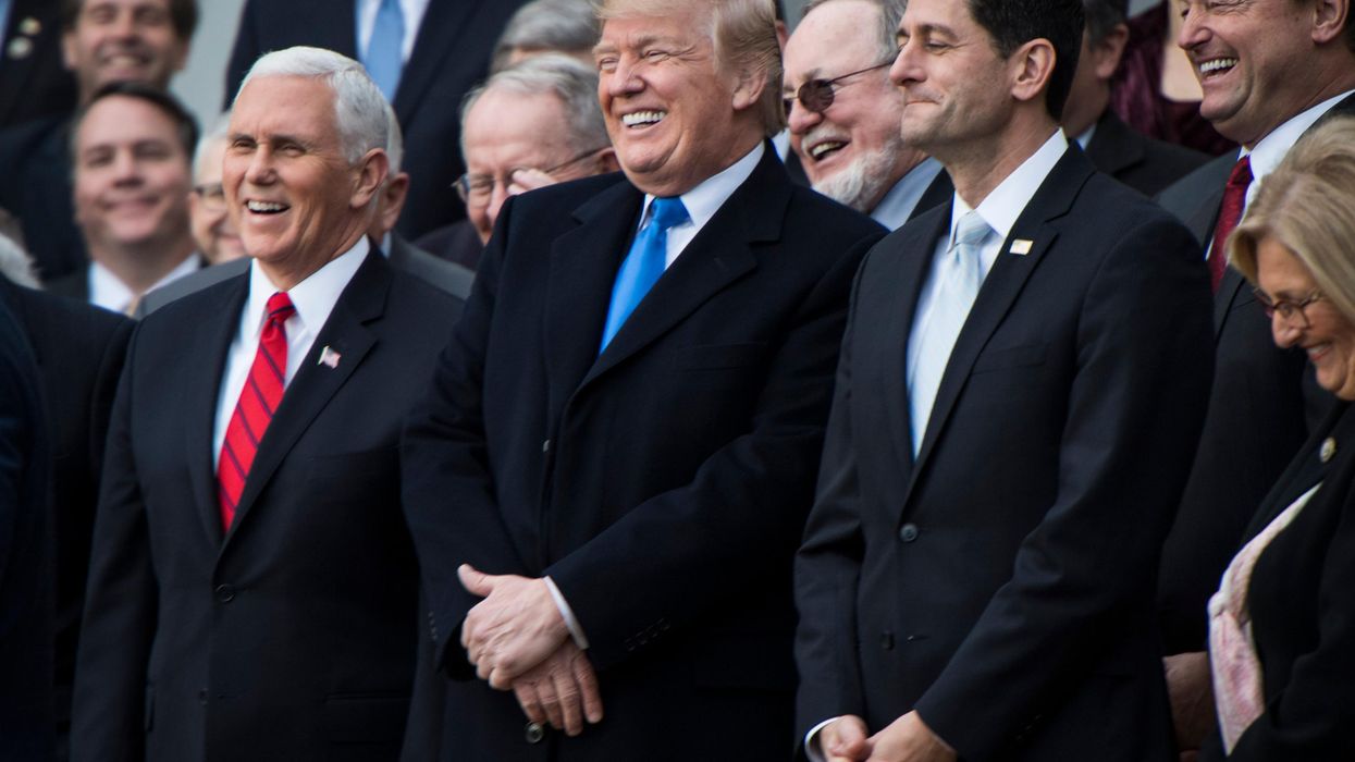 Donald Trump and Republican lawmakers celebrate passage of their tax-cut bill