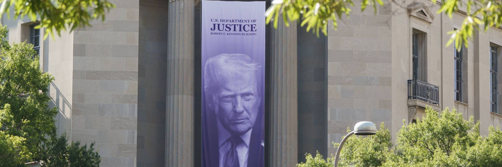 donald-trump-banner-at-u-s-department-of-justice-building.jpg?id=68394814&width=1200&height=400&coordinates=0%2C590%2C0%2C1077