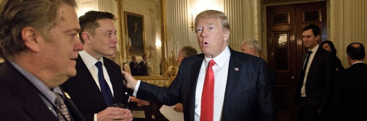 Donald Trump greets Elon Musk while Steve Bannon watches