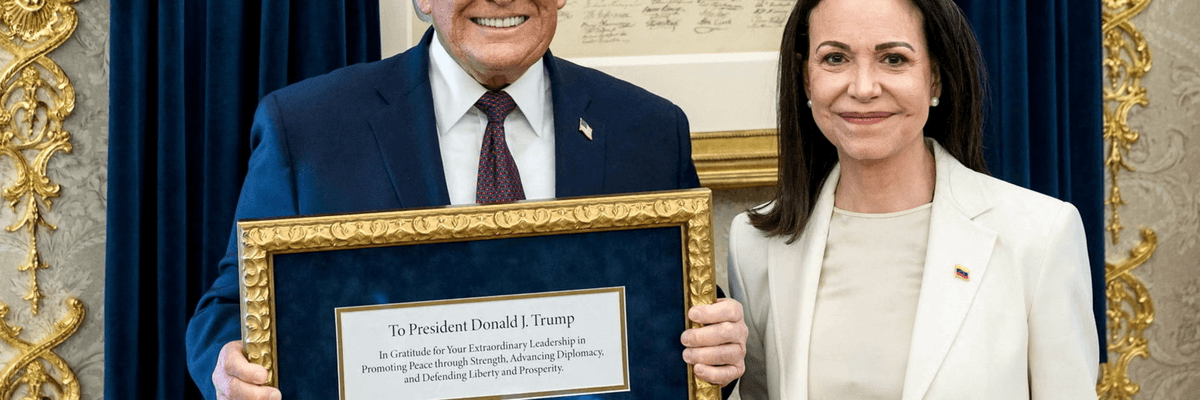 Donald Trump holds a framed Nobel Peace Prize given to him by winner María Corina Machado