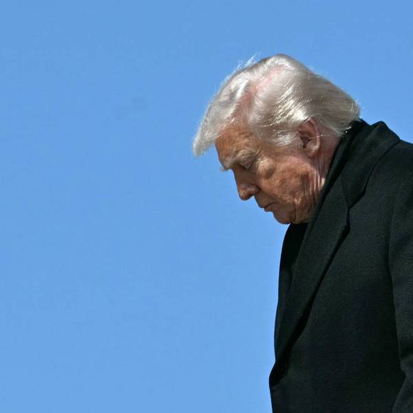 Donald Trump in profile with head down.
