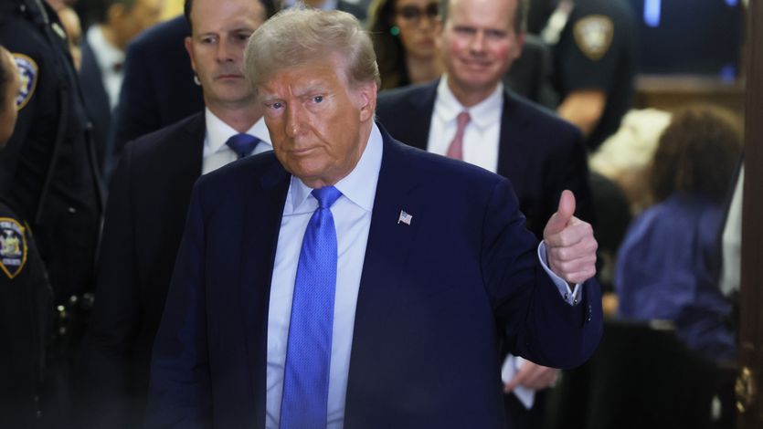 Donald Trump leaving courtroom with thumb up