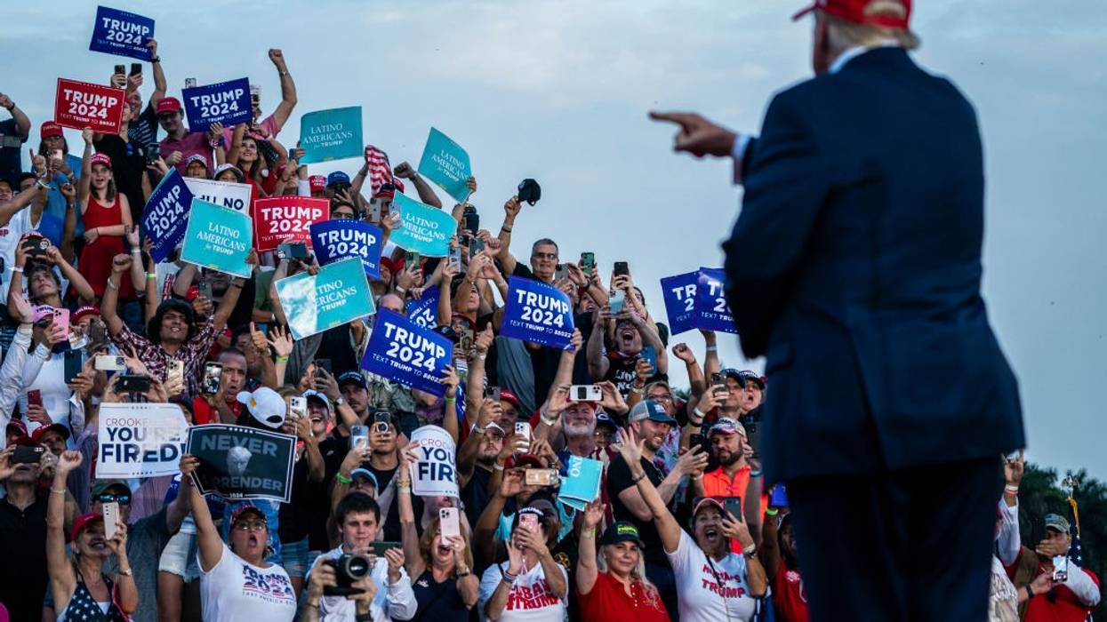 Donald Trump points at crowd of Trump supporters