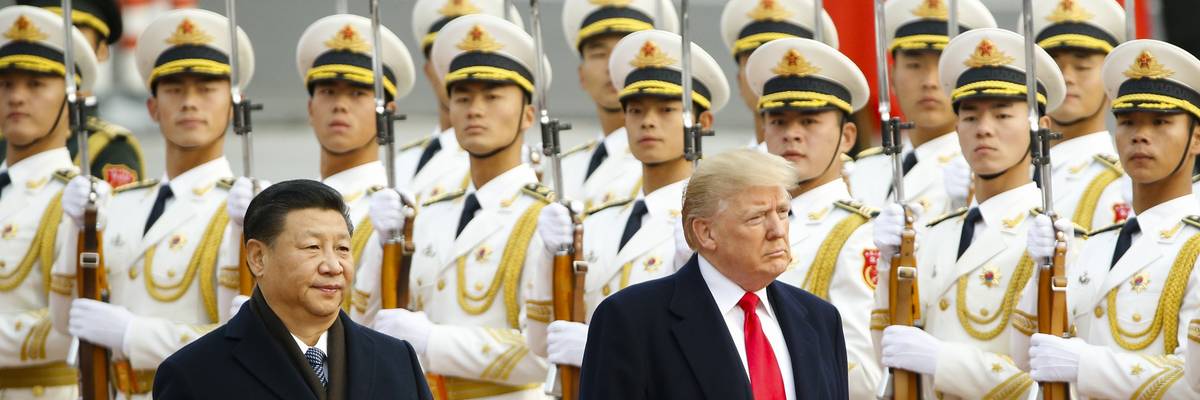Donald Trump takes part in a welcoming ceremony with China's President Xi Jinping