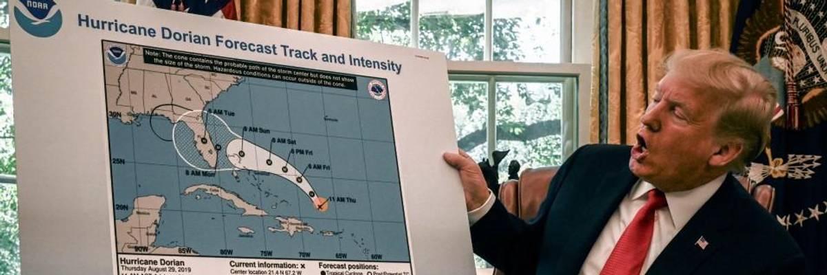 Donald Trump with altered Dorian map.