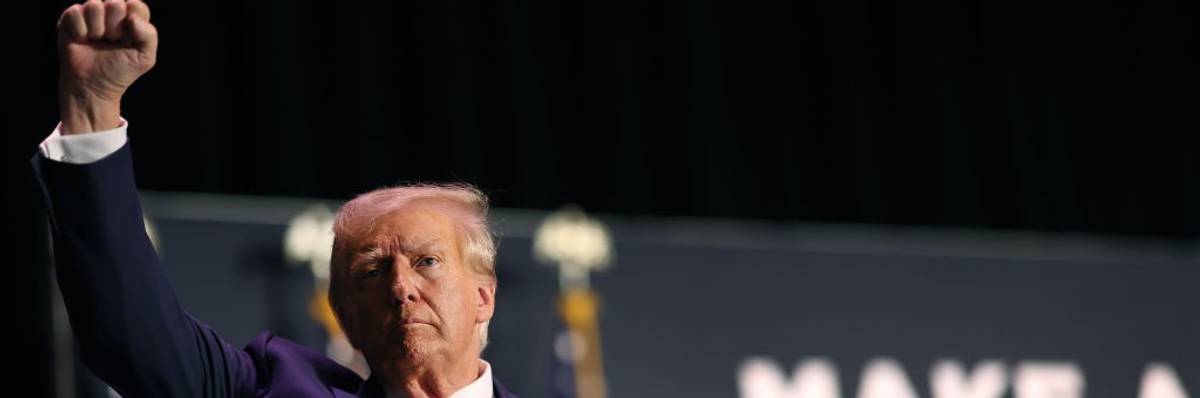 Donald Trump with his fist up during rally in Sioux City, Iowa