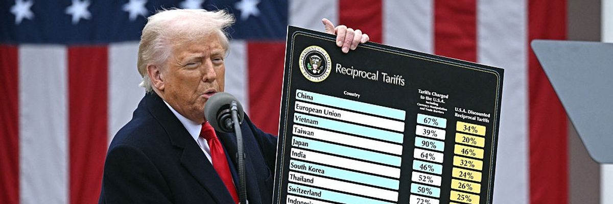Donald Trump with tariff chart.