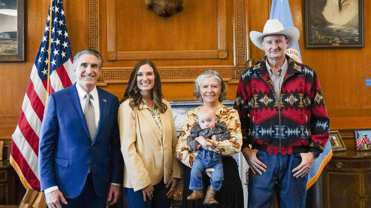 Doug Burgum, Kristi Noem, Karen Budd-Falen, and Frank Falen pose for a photo
