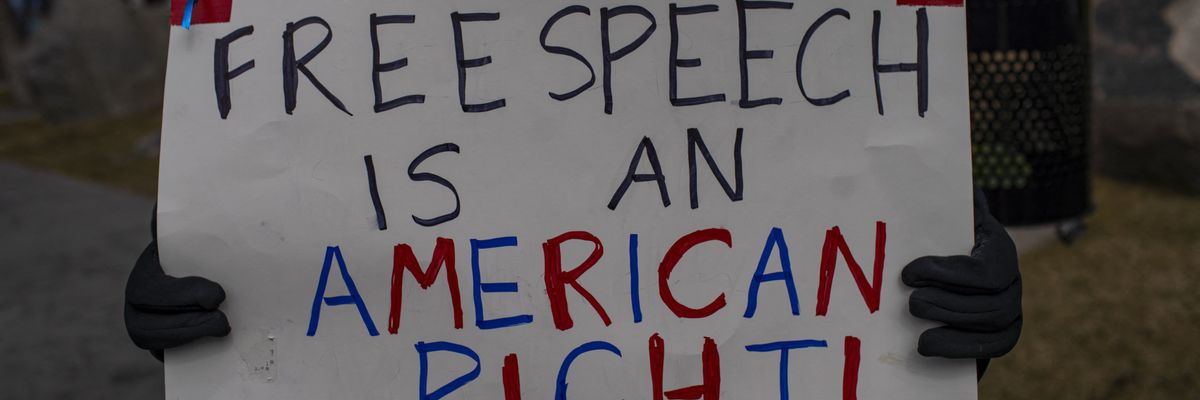 Dozens of people gather in front of the U.S. courthouse building to protest the arrest of Mahmoud Khalil