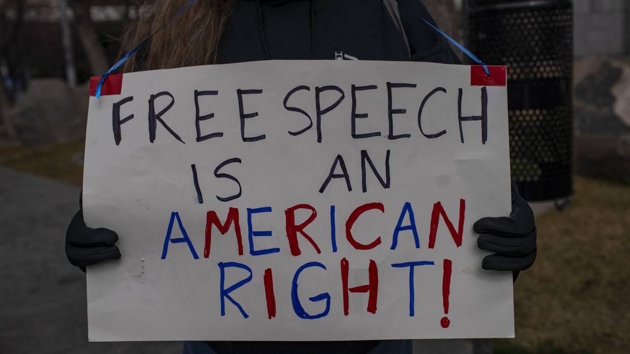 Dozens of people gather in front of the U.S. courthouse building to protest the arrest of Mahmoud Khalil