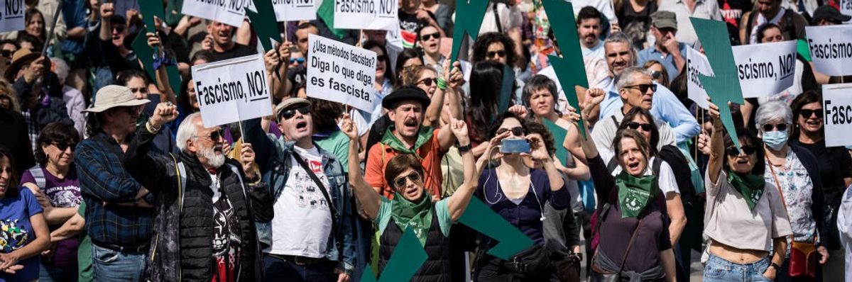 Dozens of people protest during a rally against the "Viva 24"