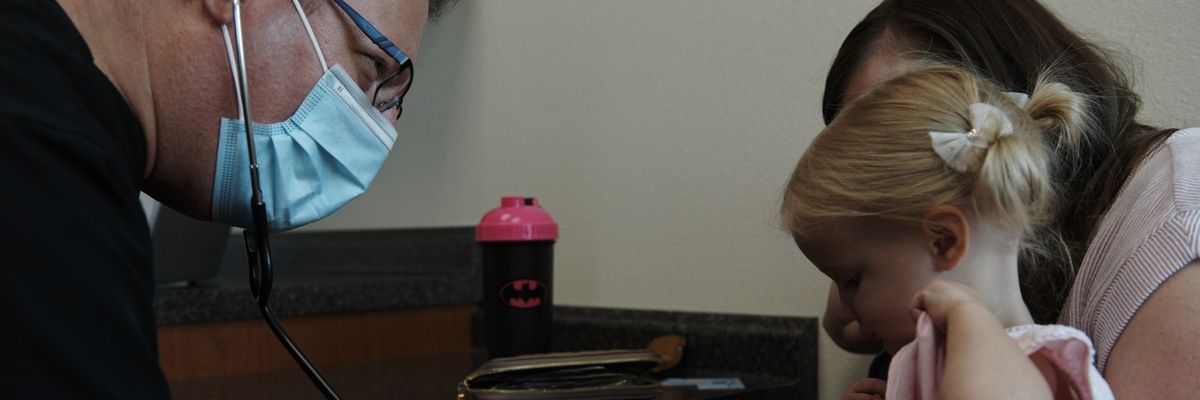 Dr. Howard Baron examines a patient