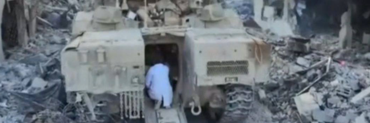 Dr. Hussam Abu Safiya enters IDF tank.