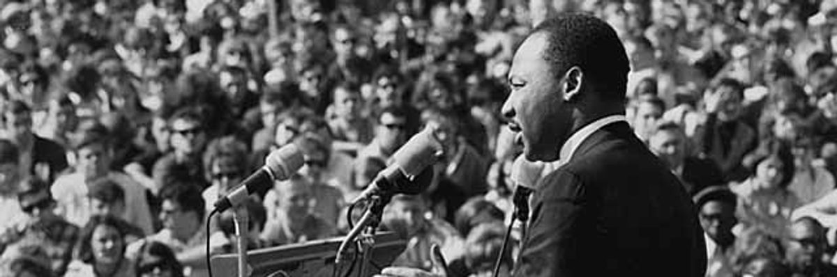 Dr. Martin Luther King speaks to an anti-war rally.