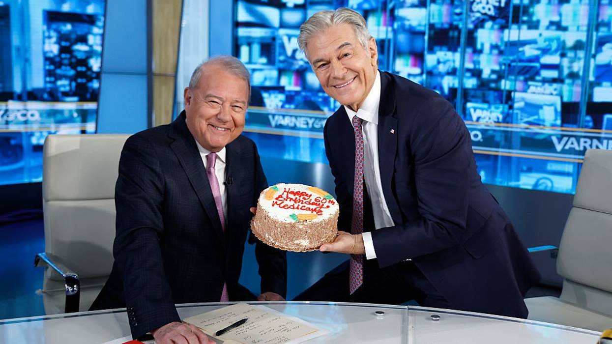 Dr. Mehmet Oz gives Fox Business host Stuart Varney a carrot cake