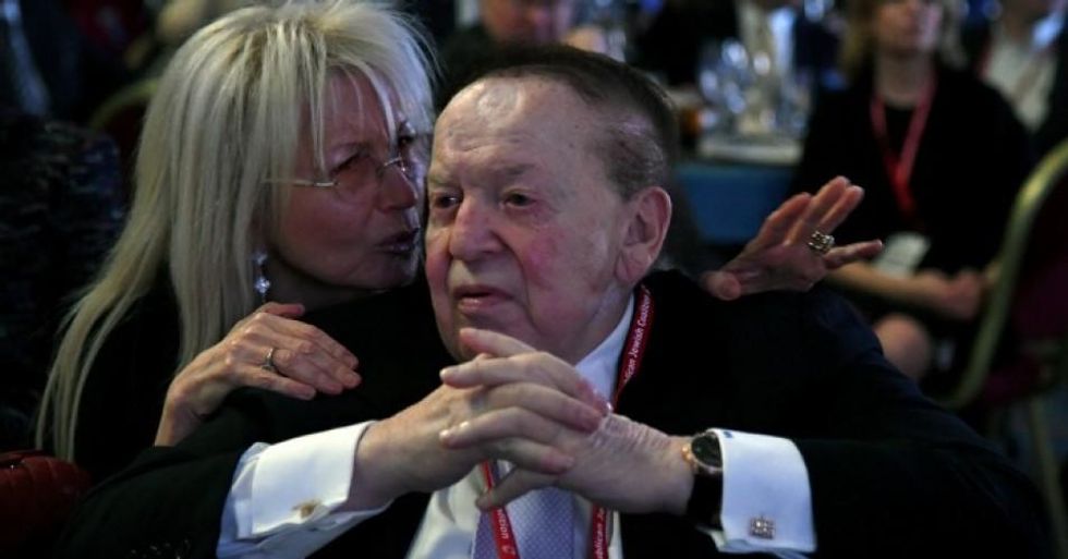Dr. Miriam Adelson talks with her husband, casino mogul Sheldon Adelson, during a speech by Vice President Mike Pence at the Republican at The Venetian Las Vegas on February 24, 2017. (Photo: Ethan Miller/Getty Images)