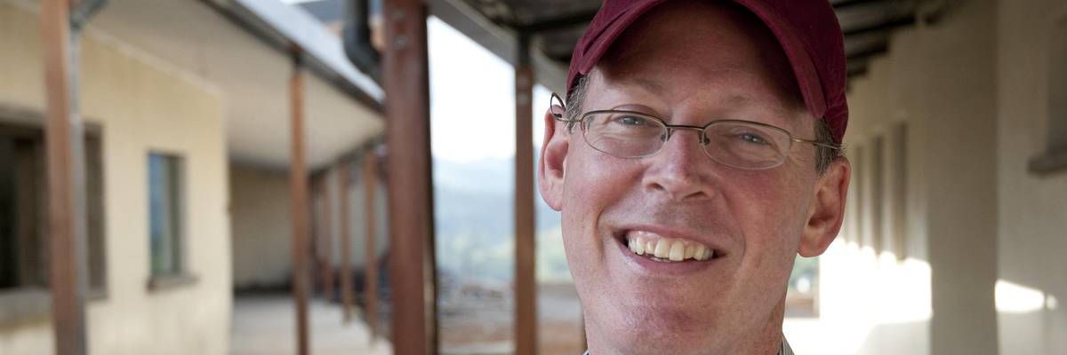 Dr. Paul Farmer stands outside the Butaro Hospital built by Partners in Health for the Rwanda Ministry of Health, on June 20, 2010 in Burera, Rwanda.