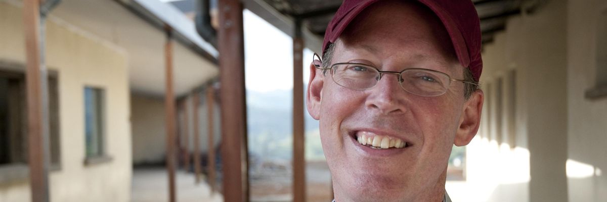 Dr. Paul Farmer stands outside the Butaro Hospital built by Partners in Health for the Rwanda Ministry of Health, on June 20, 2010 in Burera, Rwanda.
