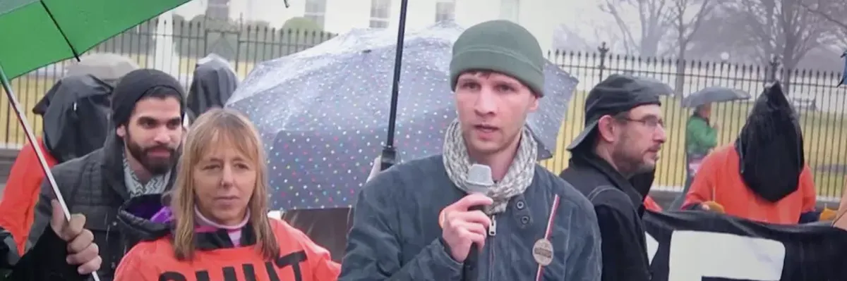 Drone whistleblower Daniel Hale (R) stands next to CodePink co-founder Medea Benjamin outside the White House in Washington, D.C. in this undated photo. (Photo: Democracy Now!)