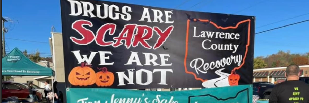 "Drugs are scary, we are not" signs says about drug addiction recovery center.