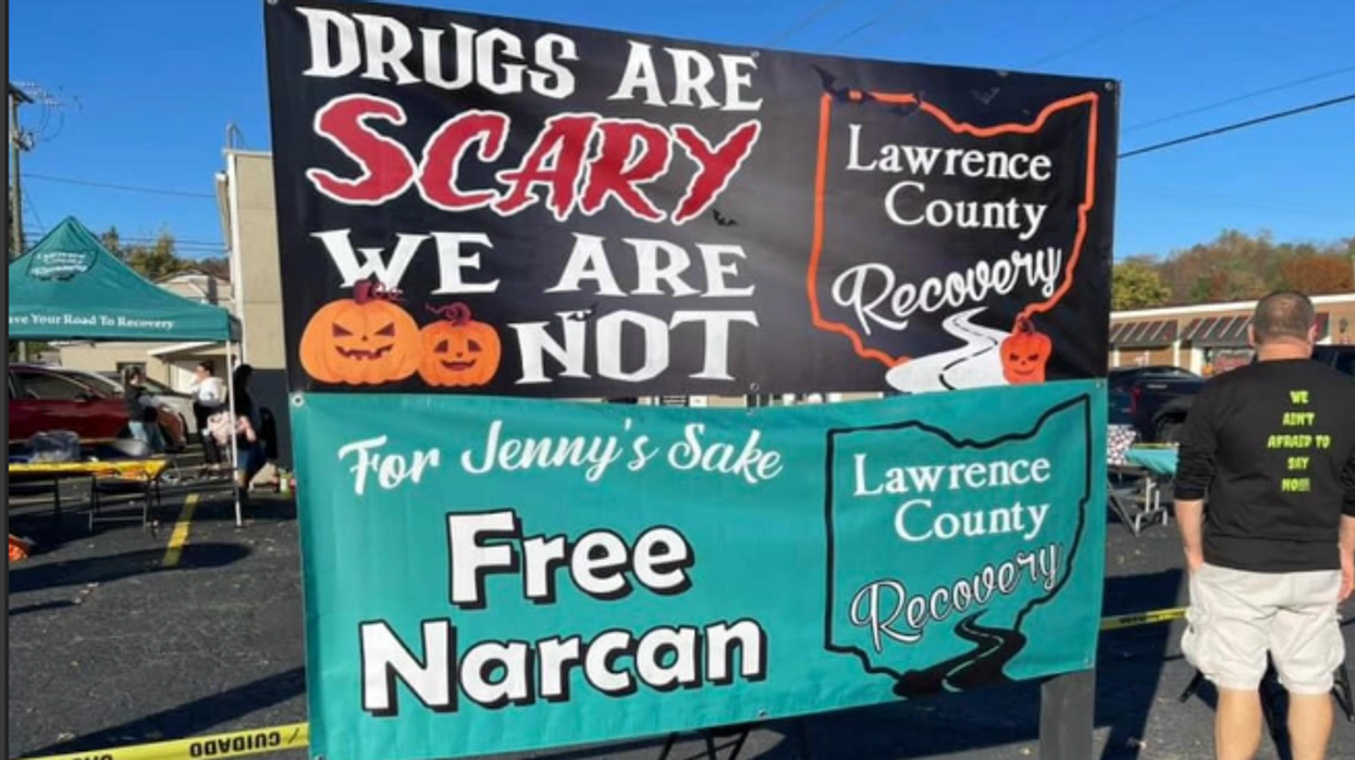 "Drugs are scary, we are not" signs says about drug addiction recovery center.