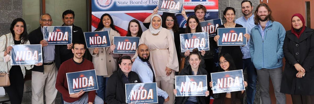 Durham County Commissioner Nida Allam, a Democratic candidate for North Carolina's 4th Congressional District, stands with campaign volunteers on February 25, 2022.