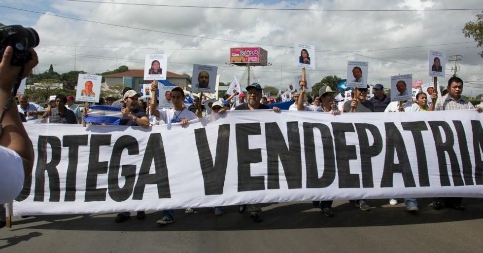 During a 2013 demonstration against the canal, protesters carry a banner that reads