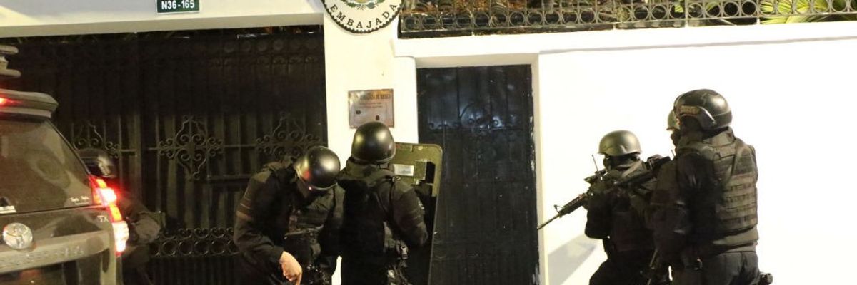 Ecuadorian police special forces in body armor prepare to break into the Mexican Embassy in Quito.