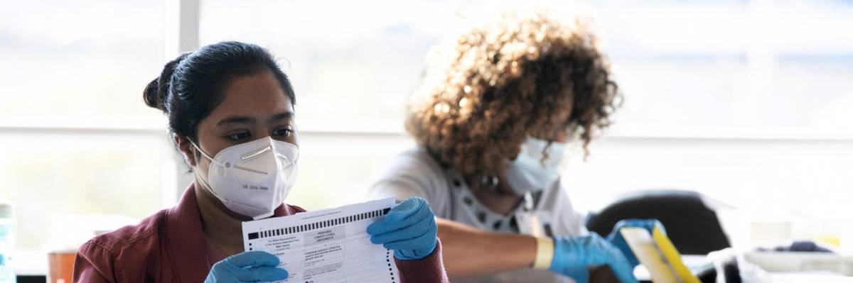 Election workers in Fulton County, Georgia count votes in November 2021.