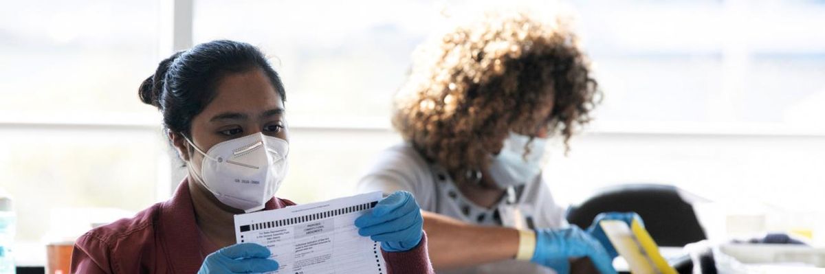 Election workers in Fulton County, Georgia count votes in November 2021.