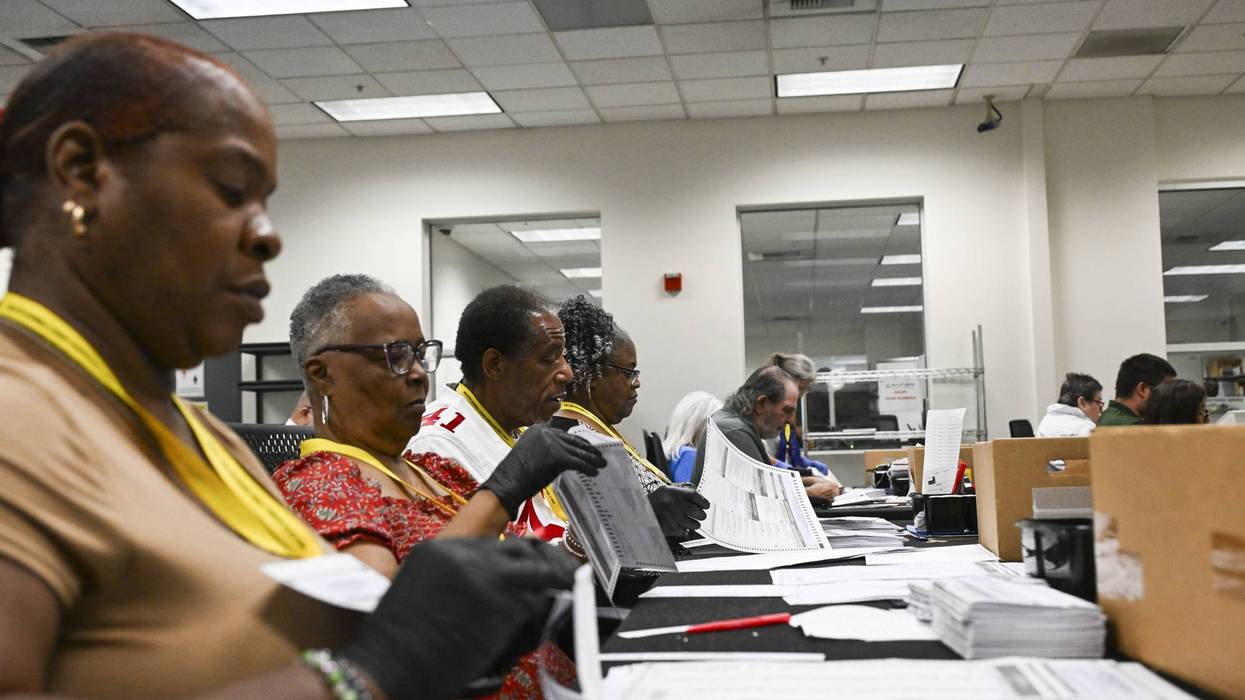 Election workers process mailed ballots in California