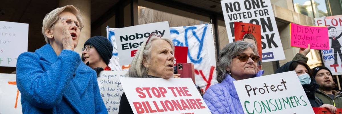 Elizabeth Warren attends a protest against Trump and Musk's attack on the CFPB