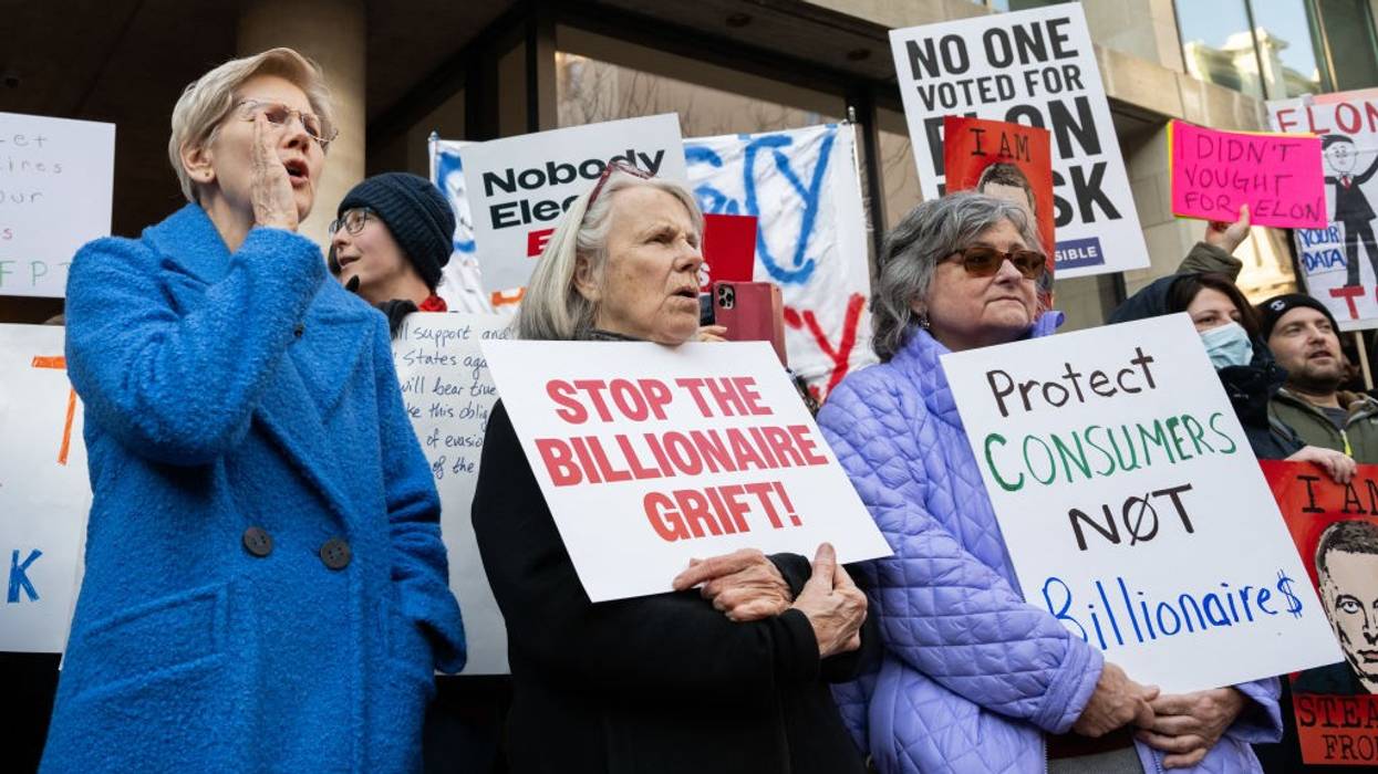 Elizabeth Warren attends a protest against Trump and Musk's attack on the CFPB
