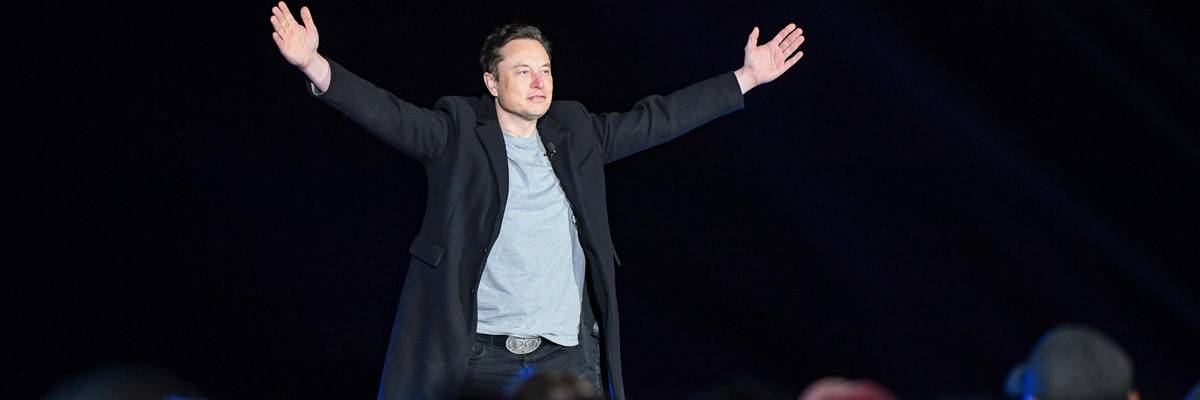 Elon Musk addresses a crowd