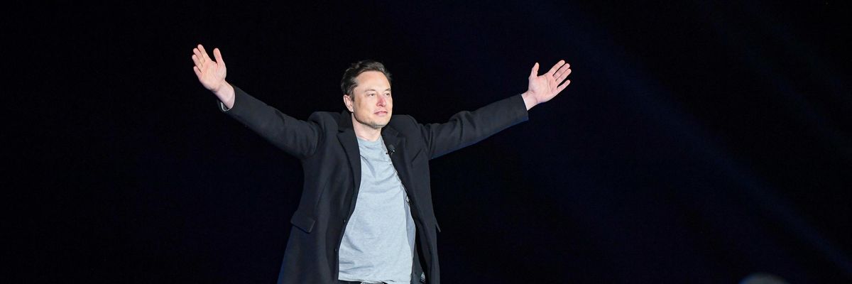 Elon Musk addresses a crowd