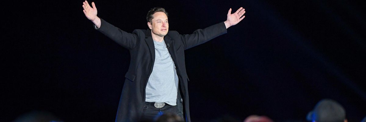 Elon Musk addresses a crowd