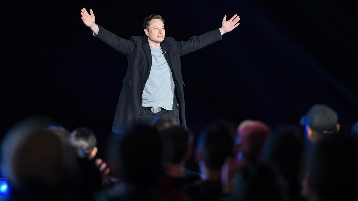 Elon Musk addresses a crowd
