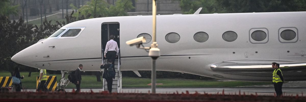 Elon Musk boards his private jet