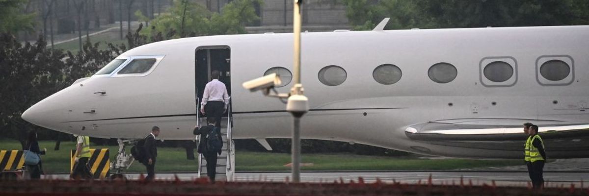 Elon Musk boards his private jet