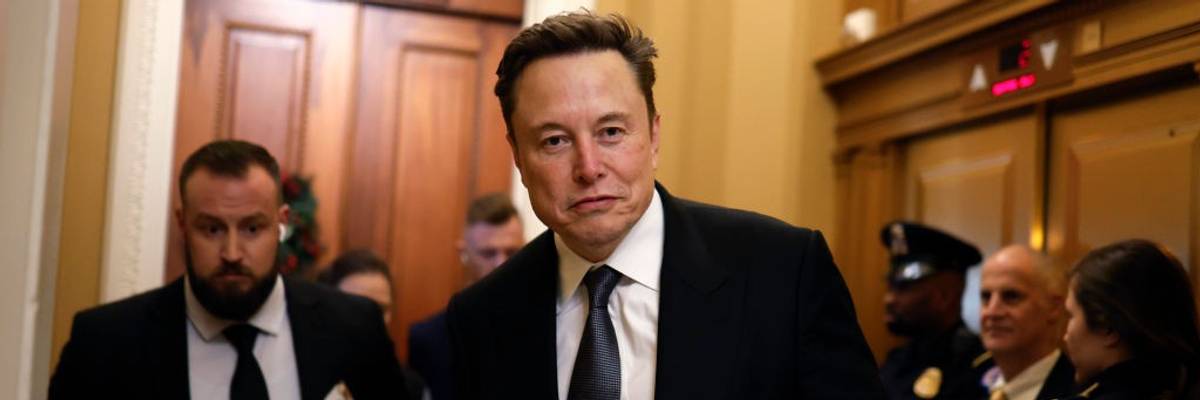 Elon Musk in a suit holding a cup of coffee