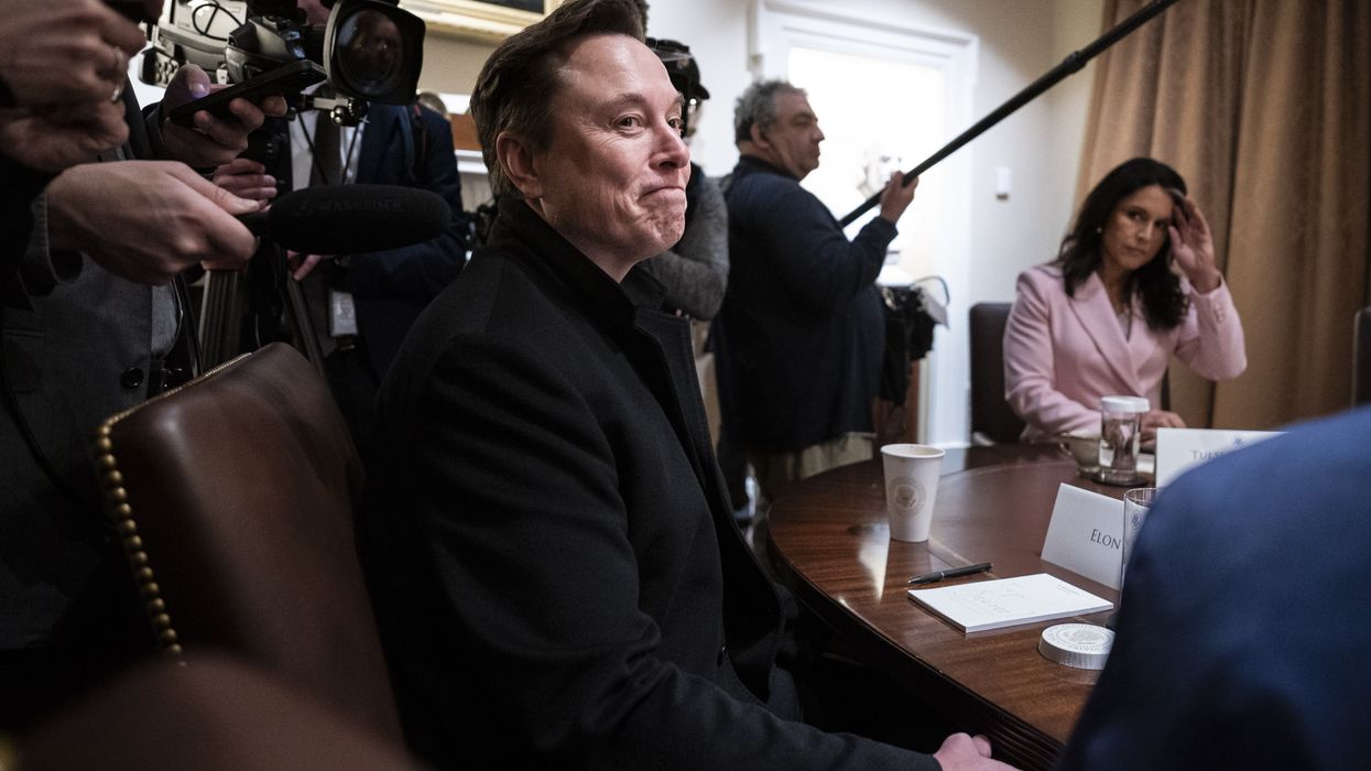 Elon Musk listens as President Donald Trump speaks during a Cabinet meeting