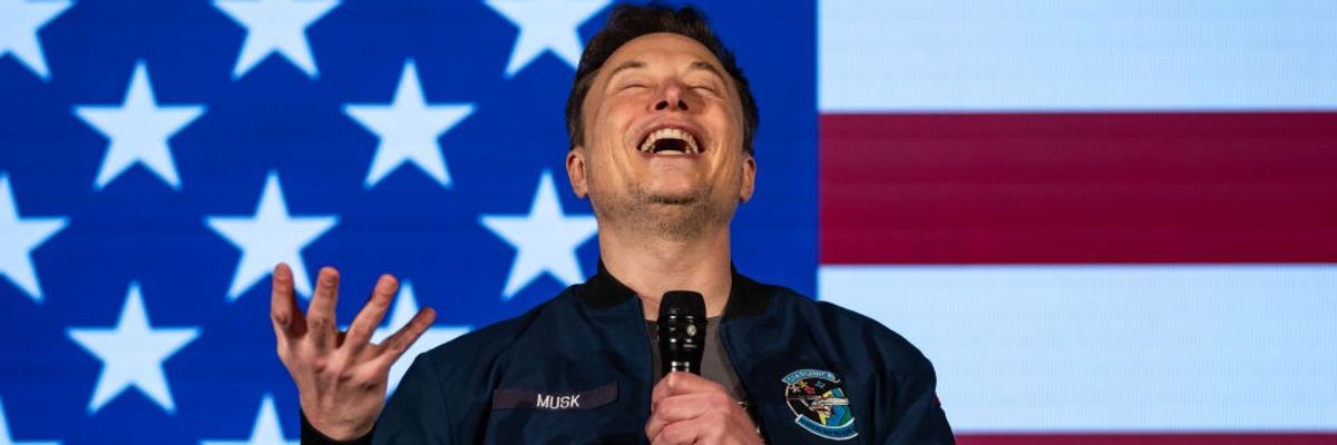 Elon Musk smiling in front of American Flag