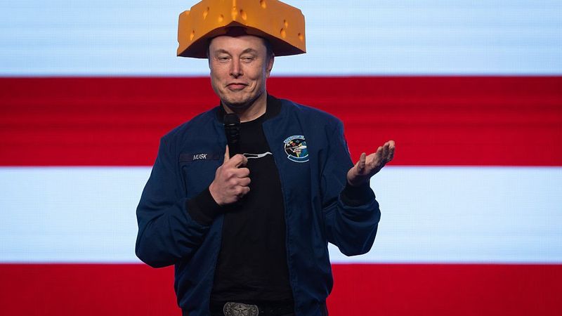 Elon Musk with cheese on his head
